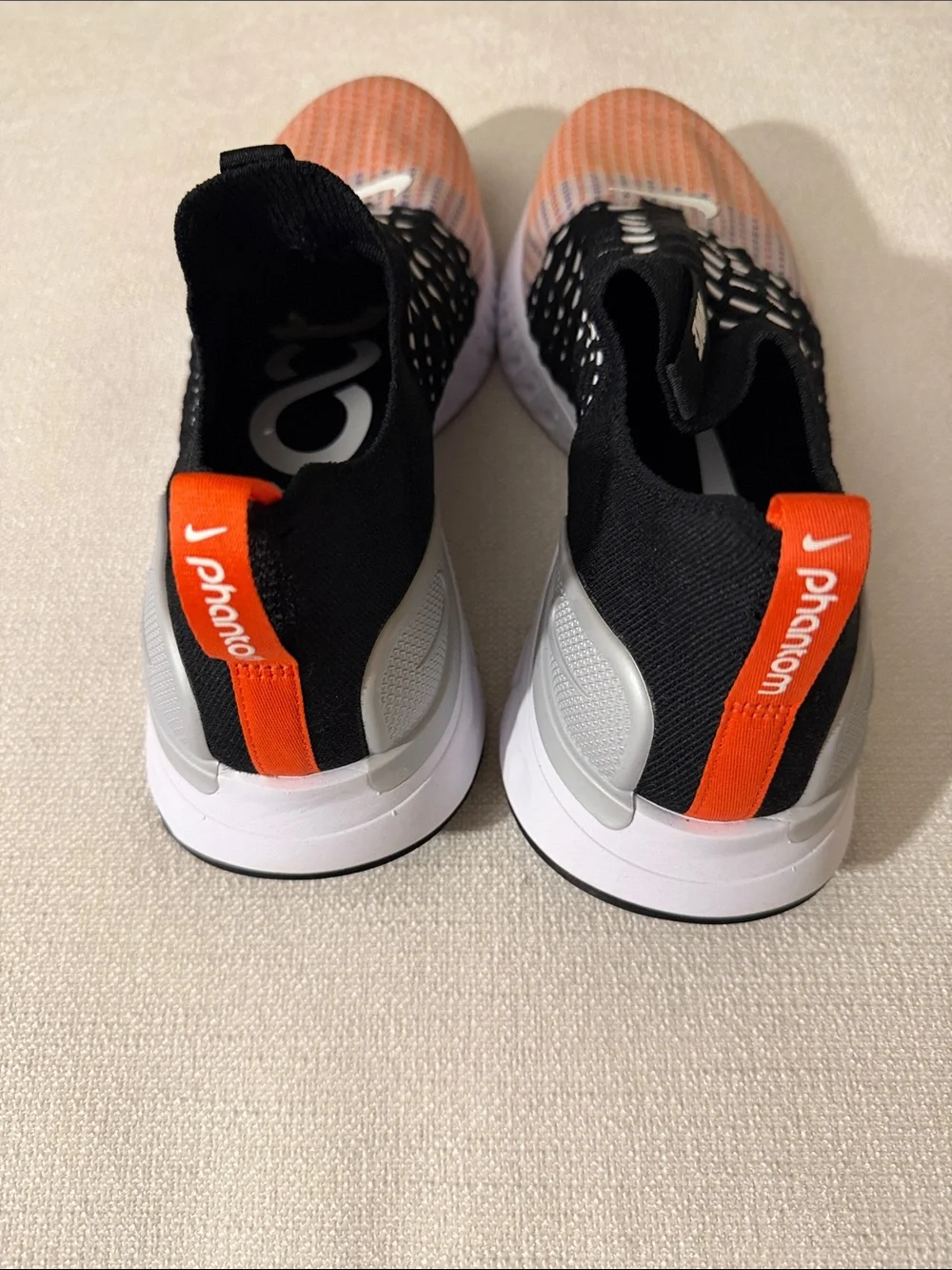 NWOB Nike Slip-On Knit Sneakers in Black, Orange, and White